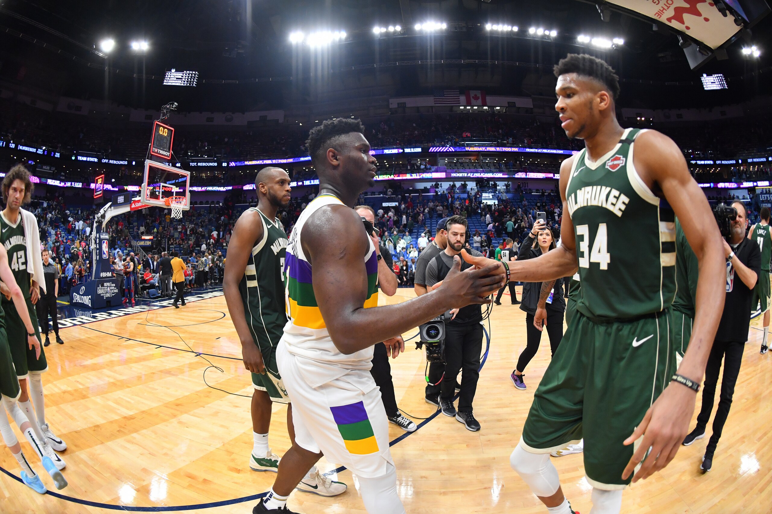 NEW ORLEANS, LA - FEBRUARY 4: Zion Williamson #1 of the New Orleans Pelicans and Giannis Antetokounmpo #34 of the Milwaukee Bucks high-five after a game on February 4, 2020 at the Smoothie King Center in New Orleans, Louisiana. NOTE TO USER: User expressly acknowledges and agrees that, by downloading and or using this Photograph, user is consenting to the terms and conditions of the Getty Images License Agreement. Mandatory Copyright Notice: Copyright 2020 NBAE (Photo by Jesse D. Garrabrant/NBAE via Getty Images)