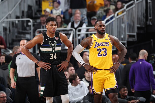 MILWAUKEE, WI - DECEMBER 19: Giannis Antetokounmpo #34 of the Milwaukee Bucks and LeBron James #23 of the Los Angeles Lakers look on during a game on December 19, 2019 at the Fiserv Forum Center in Milwaukee, Wisconsin. NOTE TO USER: User expressly acknowledges and agrees that, by downloading and or using this Photograph, user is consenting to the terms and conditions of the Getty Images License Agreement. Mandatory Copyright Notice: Copyright 2019 NBAE (Photo by Joe Murphy/NBAE via Getty Images).