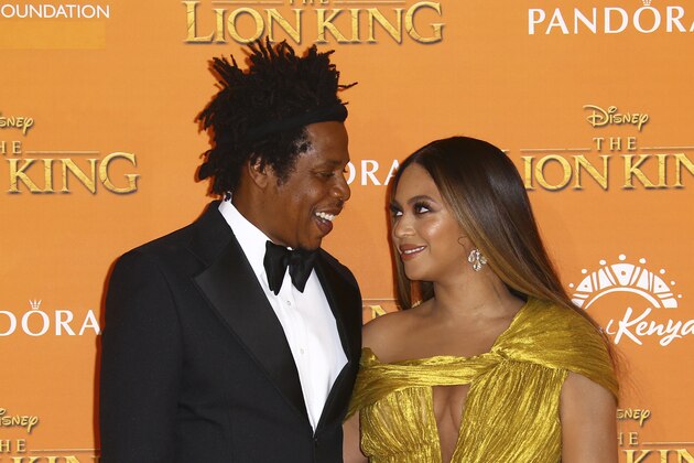Singers Jay-Z, left, and Beyonce pose for photographers upon arrival at the 'Lion King' European premiere in central London, Sunday, July 14, 2019. (Photo by Joel C Ryan/Invision/AP)