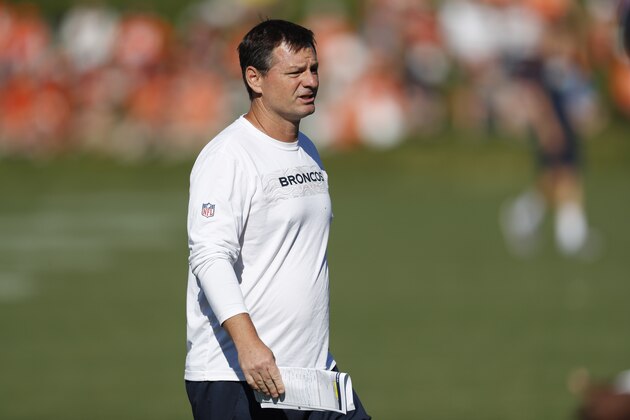 Denver Broncos offensive coordinator Rich Scangarello takes part in drills during an NFL football training camp session Monday, Aug. 5, 2019, in Englewood, Colo. (AP Photo/David Zalubowski)