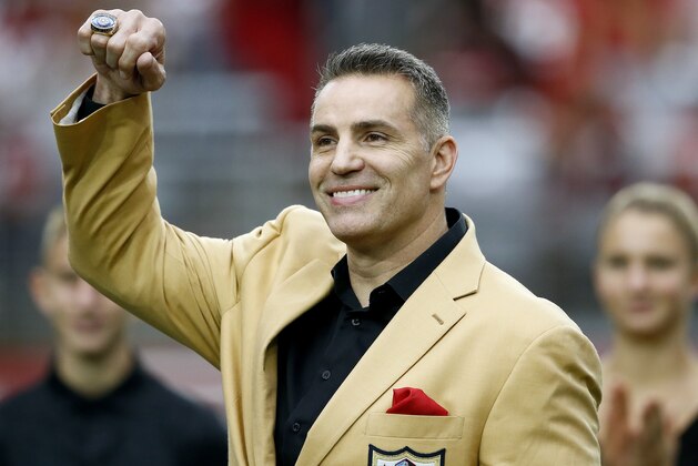 Former Arizona Cardinals quarterback Kurt Warner shows his Football Hall of Fame ring during his ring ceremony at half time of an NFL football game against the San Francisco 49ers, Sunday, Oct. 1, 2017, in Glendale, Ariz. (AP Photo/Ross D. Franklin)