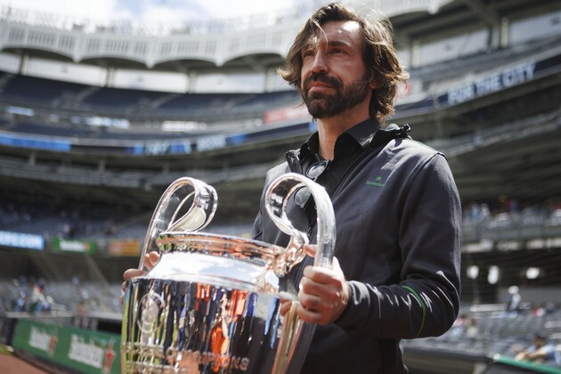 IMAGE DISTRIBUTED FOR HEINEKEN USA-  Heineken Ambassador Andrea Pirlo lifts the UEFA Champions League Trophy (again) during the UEFA Champions League Trophy Tour presented by Heineken at Yankee Stadium, Saturday, April 27, 2019 in New York. (Jason DeCrow/AP Images for Heineken USA)