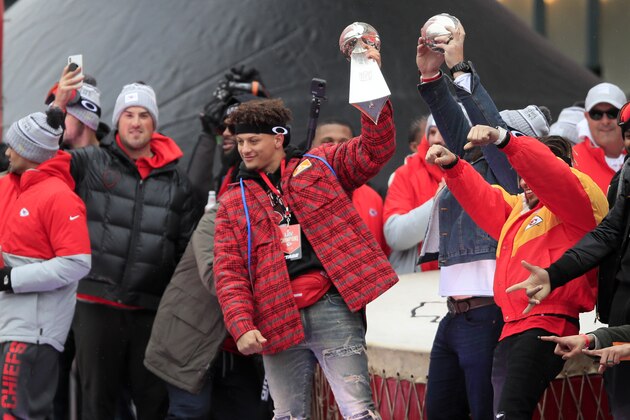 Kansas City Chiefs quarterback Patrick Mahomes holds the Super Bowl trophy during a rally in Kansas City, Mo., Wednesday, Feb. 5, 2020. (AP Photo/Orlin Wagner)