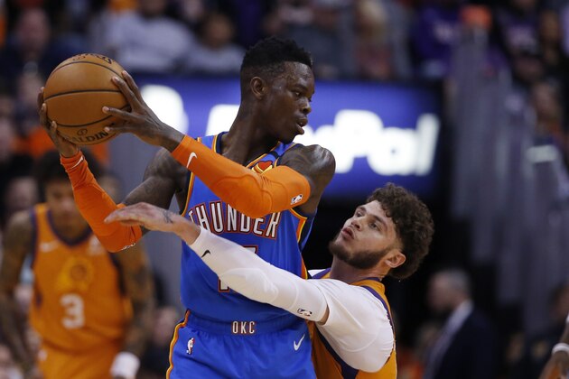 Phoenix Suns guard Tyler Johnson, right, defends against Oklahoma City Thunder guard Dennis Schroder, left, during the second half of an NBA basketball game Friday, Jan. 31, 2020, in Phoenix. The Thunder defeated the Suns 111-107. (AP Photo/Ross D. Franklin) Phoenix Suns guard Tyler Johnson, right, defends against Oklahoma City Thunder guard Dennis Schroder, left, during the second half of an NBA basketball game Friday, Jan. 31, 2020, in Phoenix. The Thunder defeated the Suns 111-107. (AP Photo/Ross D. Franklin)