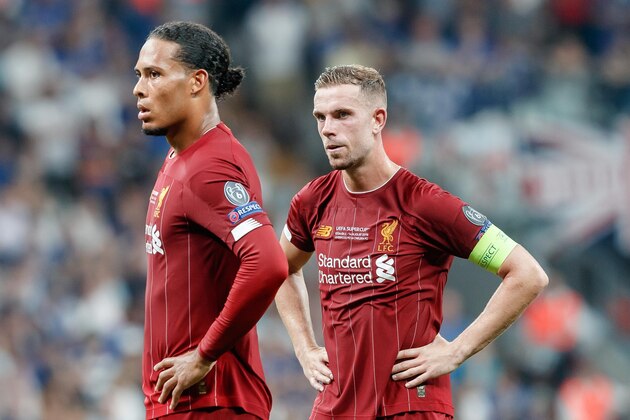 ISTANBUL, TURKEY - AUGUST 14: Virgil van Dijk of Liverpool FC and Jordan Henderson of Liverpool FC look on during the UEFA Super Cup match between FC Liverpool and FC Chelsea at Vodafone Park on August 14, 2019 in Istanbul, Turkey. (Photo by TF-Images/ Getty Images)