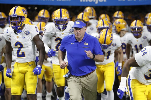Pittsburgh head coach Pat Narduzzi runs out with the team before the first half of the Quick Lane Bowl NCAA college football game against Eastern Michigan, Thursday, Dec. 26, 2019, in Detroit. (AP Photo/Carlos Osorio)