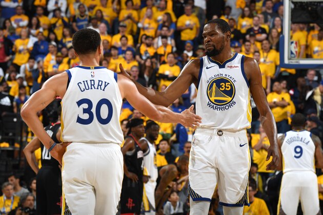 OAKLAND, CA - APRIL 28: Stephen Curry #30 of the Golden State Warriors high-fives Kevin Durant #35 of the Golden State Warriors against the Houston Rockets during the Western Conference Semifinals of the NBA Playoffs on April 28, 2019 at ORACLE Arena in Oakland, California. NOTE TO USER: User expressly acknowledges and agrees that, by downloading and or using this photograph, user is consenting to the terms and conditions of Getty Images License Agreement. Mandatory Copyright Notice: Copyright 2019 NBAE (Photo by Andrew D. Bernstein/NBAE via Getty Images) OAKLAND, CA - APRIL 28: Stephen Curry #30 of the Golden State Warriors high-fives Kevin Durant #35 of the Golden State Warriors against the Houston Rockets during the Western Conference Semifinals of the NBA Playoffs on April 28, 2019 at ORACLE Arena in Oakland, California. NOTE TO USER: User expressly acknowledges and agrees that, by downloading and or using this photograph, user is consenting to the terms and conditions of Getty Images License Agreement. Mandatory Copyright Notice: Copyright 2019 NBAE (Photo by Andrew D. Bernstein/NBAE via Getty Images)