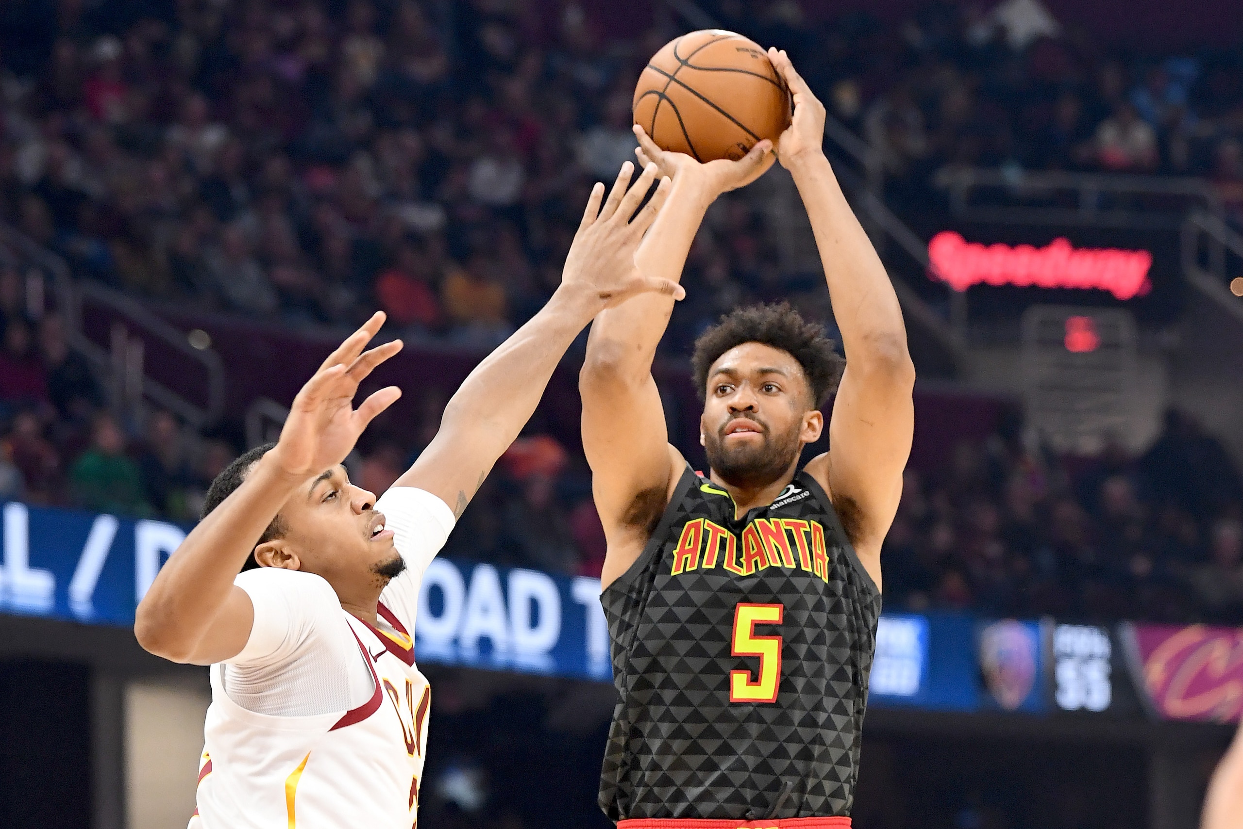 CLEVELAND, OHIO - DECEMBER 23: Jabari Parker #5 of the Atlanta Hawks shoots over John Henson #31 of the Cleveland Cavaliers during the first half at Rocket Mortgage Fieldhouse on December 23, 2019 in Cleveland, Ohio. NOTE TO USER: User expressly acknowledges and agrees that, by downloading and/or using this photograph, user is consenting to the terms and conditions of the Getty Images License Agreement. (Photo by Jason Miller/Getty Images)