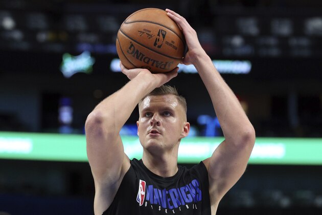 Dallas Mavericks forward Kristaps Porzingis (6) shoots during warmups before an NBA basketball game against the Los Angeles Lakers Friday, Jan. 10, 2020, in Dallas. (AP Photo/Richard W. Rodriguez)