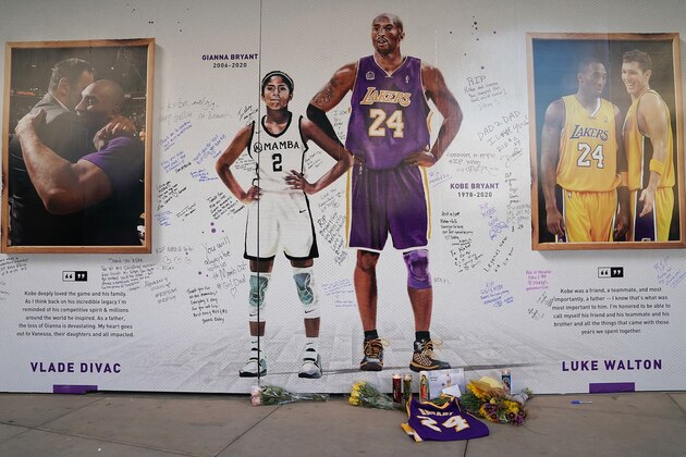 SACRAMENTO, CALIFORNIA - FEBRUARY 01: Fans honor Kobe Bryant and his daughter Gianna Bryant at an art installation wall in remembrance of Kobe and Gianna in the plaza across from Golden 1 Center prior to the Los Angeles Lakers Sacramento Kings basket ball game at Golden 1 Center on February 01, 2020 in Sacramento, California. NOTE TO USER: User expressly acknowledges and agrees that, by downloading and or using this photograph, User is consenting to the terms and conditions of the Getty Images License Agreement. (Photo by Thearon W. Henderson/Getty Images)
