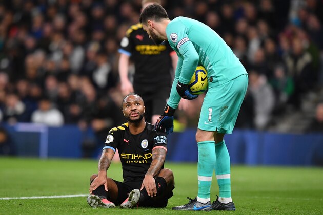Manchester City's English midfielder Raheem Sterling (L) goes down with an injury during the English Premier League football match between Tottenham Hotspur and Manchester City at Tottenham Hotspur Stadium in London, on February 2, 2020. (Photo by Ben STANSALL / AFP) / RESTRICTED TO EDITORIAL USE. No use with unauthorized audio, video, data, fixture lists, club/league logos or 'live' services. Online in-match use limited to 120 images. An additional 40 images may be used in extra time. No video emulation. Social media in-match use limited to 120 images. An additional 40 images may be used in extra time. No use in betting publications, games or single club/league/player publications. /  (Photo by BEN STANSALL/AFP via Getty Images)