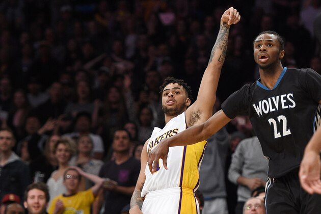 LOS ANGELES, CA - APRIL 9: D'Angelo Russell #1 of the Los Angeles Lakers scores the game-winning, three-point basket at the buzzer with Andrew Wiggins #22 and Karl-Anthony Towns #32 of the Minnesota Timberwolves looking on during the second half of the basketball game at Staples Center April 9, 2017, in Los Angeles, California. NOTE TO USER: User expressly acknowledges and agrees that, by downloading and or using this photograph, User is consenting to the terms and conditions of the Getty Images License Agreement. (Photo by Kevork Djansezian/Getty Images)