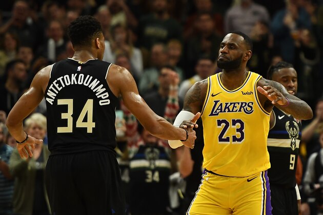 MILWAUKEE, WISCONSIN - DECEMBER 19:  Giannis Antetokounmpo #34 of the Milwaukee Bucks and LeBron James #23 of the Los Angeles Lakers hug following a game at Fiserv Forum on December 19, 2019 in Milwaukee, Wisconsin. NOTE TO USER: User expressly acknowledges and agrees that, by downloading and or using this photograph, User is consenting to the terms and conditions of the Getty Images License Agreement. (Photo by Stacy Revere/Getty Images)
