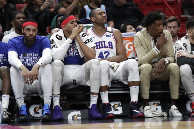 Philadelphia 76ers forward Mike Scott, left, watches from the bench with forward Al Horford (42) and guard Josh Richardson, right, during the closing minutes of an NBA basketball game against the Miami Heat, Monday, Feb. 3, 2020, in Miami. The Heat won 137-106. (AP Photo/Lynne Sladky) Philadelphia 76ers forward Mike Scott, left, watches from the bench with forward Al Horford (42) and guard Josh Richardson, right, during the closing minutes of an NBA basketball game against the Miami Heat, Monday, Feb. 3, 2020, in Miami. The Heat won 137-106. (AP Photo/Lynne Sladky)