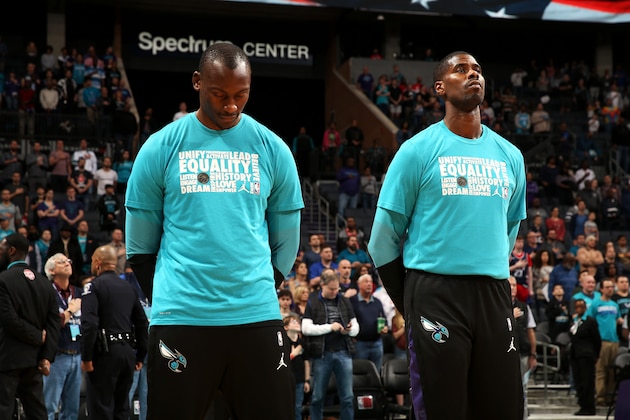CHARLOTTE, NC - FEBRUARY 5: Bismack Biyombo #8 and Marvin Williams #2 of the Charlotte Hornets stand for the national anthem before the game against the LA Clippers on February 5, 2019 at Spectrum Center in Charlotte, North Carolina. NOTE TO USER: User expressly acknowledges and agrees that, by downloading and or using this photograph, User is consenting to the terms and conditions of the Getty Images License Agreement. Mandatory Copyright Notice: Copyright 2019 NBAE (Photo by Kent Smith/NBAE via Getty Images) CHARLOTTE, NC - FEBRUARY 5: Bismack Biyombo #8 and Marvin Williams #2 of the Charlotte Hornets stand for the national anthem before the game against the LA Clippers on February 5, 2019 at Spectrum Center in Charlotte, North Carolina. NOTE TO USER: User expressly acknowledges and agrees that, by downloading and or using this photograph, User is consenting to the terms and conditions of the Getty Images License Agreement. Mandatory Copyright Notice: Copyright 2019 NBAE (Photo by Kent Smith/NBAE via Getty Images)