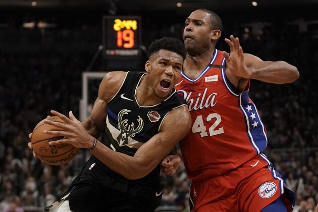 Milwaukee Bucks' Giannis Antetokounmpo drives past Philadelphia 76ers' Al Horford during the second half of an NBA basketball game Thursday, Feb. 6, 2020, in Milwaukee. The Bucks won 112-101. (AP Photo/Morry Gash)