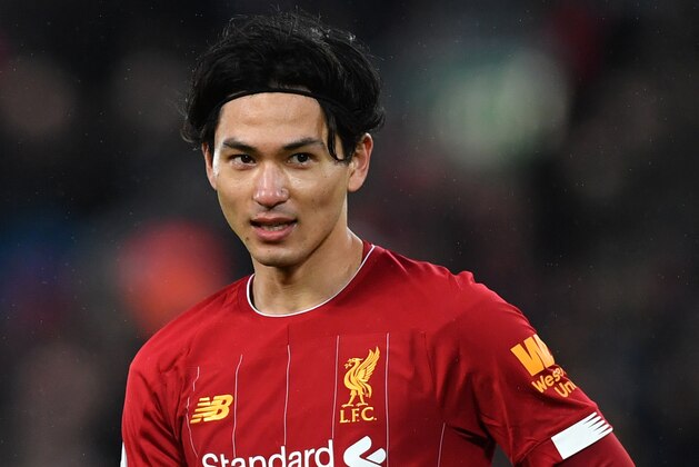 Liverpool's Japanese midfielder Takumi Minamino reacts during the English Premier League football match between Liverpool and Southampton at Anfield in Liverpool, north west England on February 1, 2020. (Photo by Paul ELLIS / AFP) / RESTRICTED TO EDITORIAL USE. No use with unauthorized audio, video, data, fixture lists, club/league logos or 'live' services. Online in-match use limited to 120 images. An additional 40 images may be used in extra time. No video emulation. Social media in-match use limited to 120 images. An additional 40 images may be used in extra time. No use in betting publications, games or single club/league/player publications. /  (Photo by PAUL ELLIS/AFP via Getty Images)
