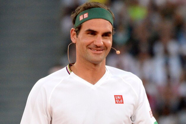 Switzerland's Roger Federer reacts after a point against Spain's Rafael Nadal and American philanthropist Bill Gates during their double's tennis match at The Match in Africa at the Cape Town Stadium, in Cape Town on February 7, 2020. (Photo by RODGER BOSCH / AFP) (Photo by RODGER BOSCH/AFP via Getty Images)