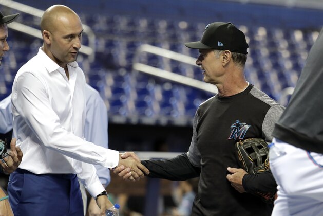 Miami Marlins CEO Derek Jeter, left, shakes hands with manager Don Mattingly before a baseball game against the Atlanta Braves, Friday, May 3, 2019, in Miami. (AP Photo/Lynne Sladky)