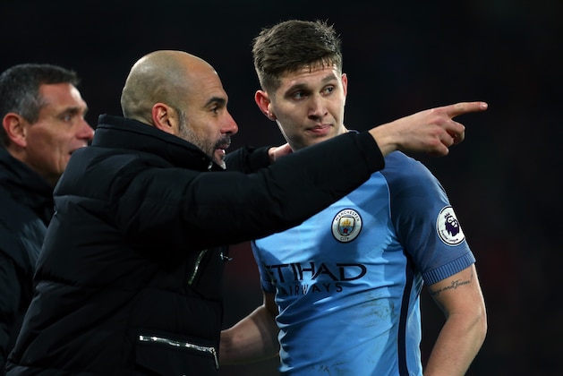 BOURNEMOUTH, ENGLAND - FEBRUARY 13: Pep Guardiola the manager of Manchester City talks to John Stones of Manchester City during the Premier League match between AFC Bournemouth and Manchester City at Vitality Stadium on February 13, 2017 in Bournemouth, England. (Photo by Catherine Ivill - AMA/Getty Images)
