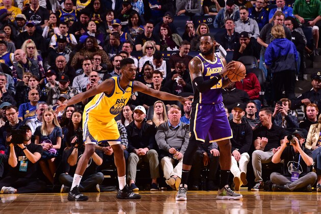 SAN FRANCISCO, CA - FEBRUARY 8: LeBron James #23 of the Los Angeles Lakers handles the ball against Andrew Wiggins #22 of the Golden State Warriors on February 8, 2020 at Chase Center in San Francisco, California. NOTE TO USER: User expressly acknowledges and agrees that, by downloading and or using this photograph, user is consenting to the terms and conditions of Getty Images License Agreement. Mandatory Copyright Notice: Copyright 2020 NBAE (Photo by Noah Graham/NBAE via Getty Images)