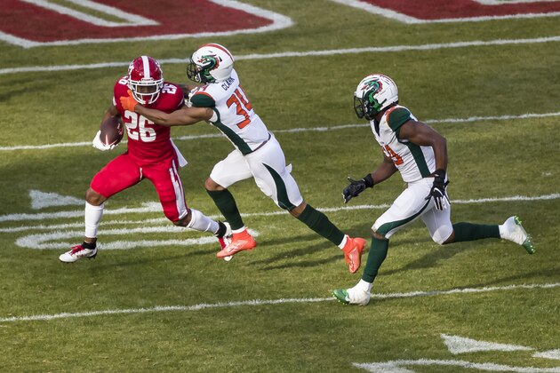 WASHINGTON, DC - FEBRUARY 08: Jhurell Pressley #26 of the DC Defenders attempts to break the tackle of Jeremy Clark #34 of the Seattle Dragons during the second half of the XFL game at Audi Field on February 8, 2020 in Washington, DC. (Photo by Scott Taetsch/Getty Images)