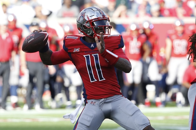 HOUSTON, TEXAS - FEBRUARY 08: P.J. Walker #11 of the Houston Roughnecks looks for a receiver against the LA Wildcats at TDECU Stadium on February 08, 2020 in Houston, Texas. (Photo by Bob Levey/Getty Images)