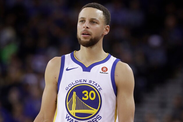 FILE - This March 6, 2018 file photo shows Golden State Warriors guard Stephen Curry during an NBA basketball game against the Brooklyn Nets in Oakland, Calif.  Sony Pictures Entertainment announced Monday, April 23, that it has struck a deal with the Golden State Warriors All-Star guard to produce television, film and possibly gaming projects. (AP Photo/Jeff Chiu, File)