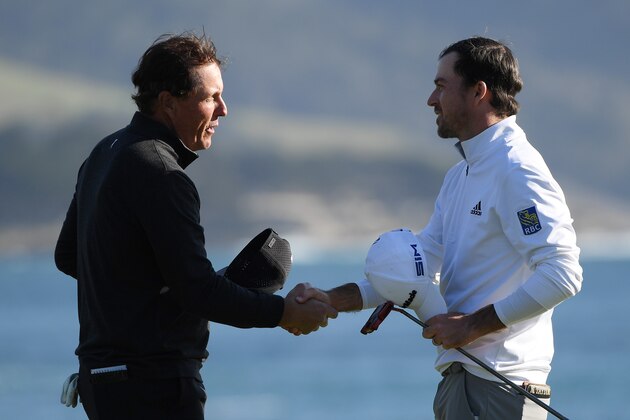 PEBBLE BEACH, CALIFORNIA - FEBRUARY 09: Nick Taylor of Canada shakes hands with Phil Mickelson of the United States on the 18th green after winning the AT&T Pebble Beach Pro-Am at Pebble Beach Golf Links on February 09, 2020 in Pebble Beach, California. (Photo by Harry How/Getty Images)