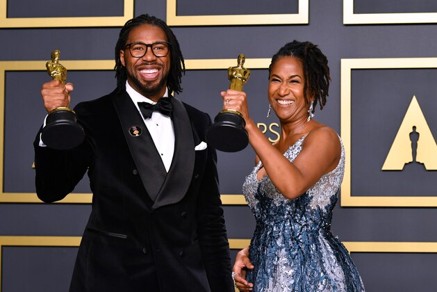 HOLLYWOOD, CALIFORNIA - FEBRUARY 09: Director Matthew A. Cherry and producer Karen Rupert Toliver, winners of the Animated Short Film award for “Hair Love,” pose in the press room during the 92nd Annual Academy Awards at Hollywood and Highland on February 09, 2020 in Hollywood, California. (Photo by Amy Sussman/Getty Images)