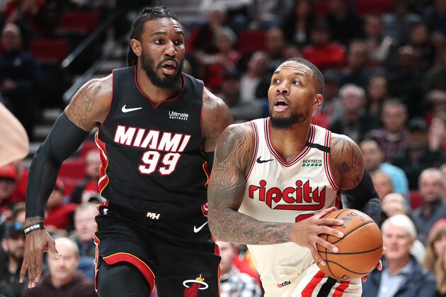 PORTLAND, OREGON - FEBRUARY 09: Damian Lillard #0 of the Portland Trail Blazers dribbles with the ball against Jae Crowder #99 of the Miami Heat in the first quarter during their game at Moda Center on February 09, 2020 in Portland, Oregon. NOTE TO USER: User expressly acknowledges and agrees that, by downloading and or using this photograph, User is consenting to the terms and conditions of the Getty Images License Agreement. (Photo by Abbie Parr/Getty Images)