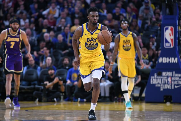 SAN FRANCISCO, CALIFORNIA - FEBRUARY 08: Andrew Wiggins #22 of the Golden State Warriors dribbles the ball up court against the Los Angeles Lakers during the second half of an NBA basketball game at Chase Center on February 08, 2020 in San Francisco, California. NOTE TO USER: User expressly acknowledges and agrees that, by downloading and or using this photograph, User is consenting to the terms and conditions of the Getty Images License Agreement. (Photo by Thearon W. Henderson/Getty Images)