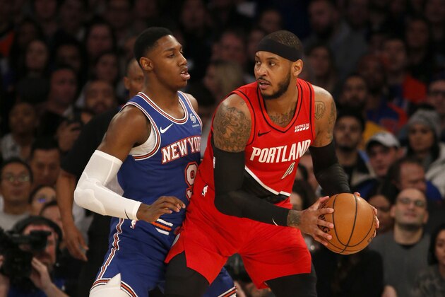 NEW YORK, NEW YORK - JANUARY 01:  (NEW YORK DAILIES OUT)   Carmelo Anthony #00 of the Portland Trail Blazers in action against RJ Barrett #9 of the New York Knicks at Madison Square Garden on January 01, 2020 in New York City. The Knicks defeated the Trail Blazers 117-93. NOTE TO USER: User expressly acknowledges and agrees that, by downloading and or using this photograph, user is consenting to the terms and conditions of the Getty Images License Agreement. (Photo by Jim McIsaac/Getty Images)