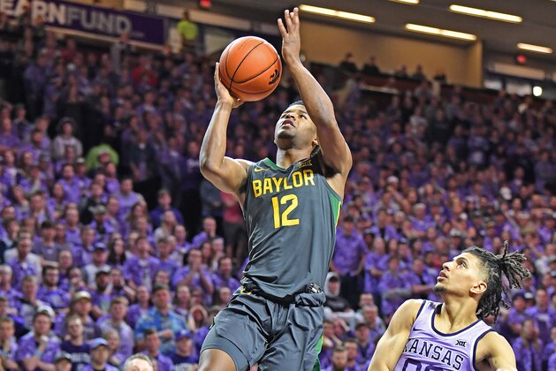 MANHATTAN, KS - FEBRUARY 03:  Jared Butler #12 of the Baylor Bears drives in for a layup against Mike McGuirl #00 of the Kansas State Wildcats during the first half at Bramlage Coliseum on February 3, 2020 in Manhattan, Kansas.  (Photo by Peter G. Aiken/Getty Images)