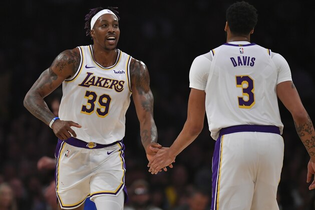 LOS ANGELES, CA - DECEMBER 29: Dwight Howard #39 and Anthony Davis #3 of the Los Angeles Lakers celebrate while playing the Dallas Mavericks at Staples Center on December 29, 2019 in Los Angeles, California. NOTE TO USER: User expressly acknowledges and agrees that, by downloading and/or using this photograph, user is consenting to the terms and conditions of the Getty Images License Agreement. (Photo by John McCoy/Getty Images)