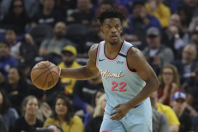 Miami Heat forward Jimmy Butler (22) dribbles upcourt against the Golden State Warriors during the first half of an NBA basketball game in San Francisco, Monday, Feb. 10, 2020. (AP Photo/Jeff Chiu)