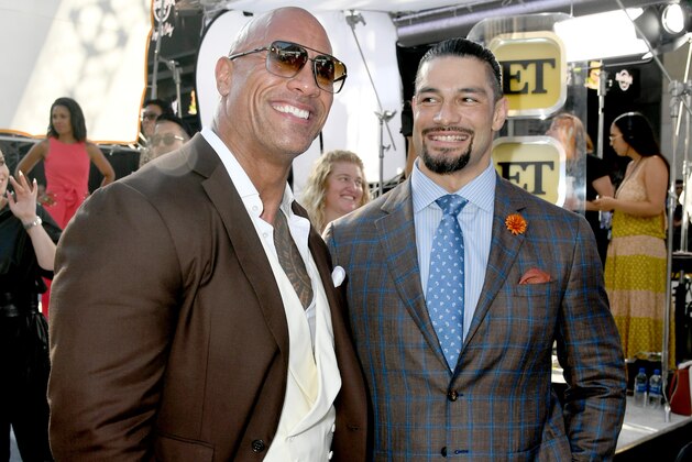 HOLLYWOOD, CALIFORNIA - JULY 13: Dwayne Johnson (L) and Roman Reigns arrive at the premiere of Universal Pictures'