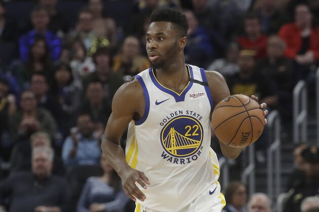 Golden State Warriors guard Andrew Wiggins (22) dribbles against the Miami Heat during the second half of an NBA basketball game in San Francisco, Monday, Feb. 10, 2020. (AP Photo/Jeff Chiu)