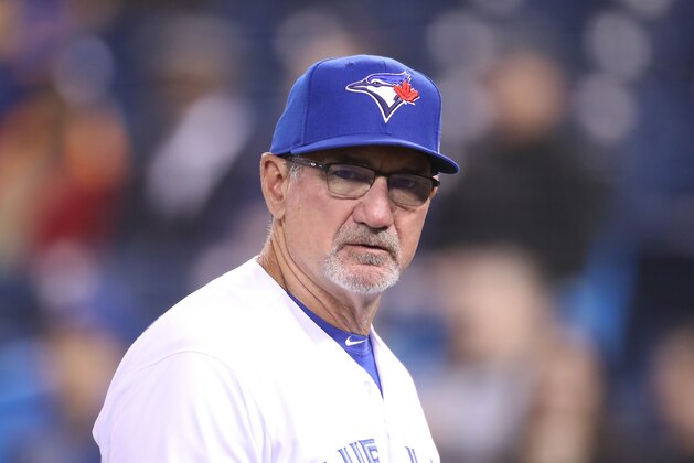 TORONTO, ON - APRIL 02: Bench coach Dave Hudgens #39 of the Toronto Blue Jays walks back to the dugout after delivering the lineup card at home plate before the start of MLB game action against the Baltimore Orioles at Rogers Centre on April 2, 2019 in Toronto, Canada. (Photo by Tom Szczerbowski/Getty Images)