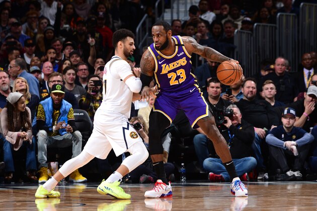 DENVER, CO - FEBRUARY 12: LeBron James #23 of the Los Angeles Lakers posts up on Jamal Murray #27 of the Denver Nuggets on February 12, 2020 at the Pepsi Center in Denver, Colorado. NOTE TO USER: User expressly acknowledges and agrees that, by downloading and/or using this Photograph, user is consenting to the terms and conditions of the Getty Images License Agreement. Mandatory Copyright Notice: Copyright 2020 NBAE (Photo by Bart Young/NBAE via Getty Images)