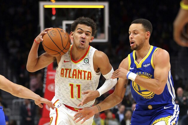 Atlanta Hawks guard Trae Young, left, drives against Golden State Warriors guard Stephen Curry, right, during the first half of an NBA basketball game Monday, Dec. 3, 2018, in Atlanta. (AP Photo/John Bazemore) Atlanta Hawks guard Trae Young, left, drives against Golden State Warriors guard Stephen Curry, right, during the first half of an NBA basketball game Monday, Dec. 3, 2018, in Atlanta. (AP Photo/John Bazemore)
