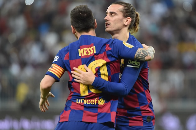 Barcelona's Argentine forward Lionel Messi (L) celebrates with Barcelona's French forward Antoine Griezmann during the Spanish Super Cup semi final between Barcelona and Atletico Madrid on January 9, 2020, at the King Abdullah Sport City in the Saudi Arabian port city of Jeddah. - The winner will face Real Madrid in the final on January 12. (Photo by FAYEZ NURELDINE / AFP) (Photo by FAYEZ NURELDINE/AFP via Getty Images)
