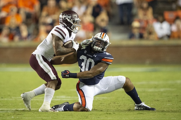 AUBURN, AL - SEPTEMBER 28: Linebacker Michael Harris #30 of the Auburn Tigers looks to tackle running back Kylin Hill #8 of the Mississippi State Bulldogs during the fourth quarter at Jordan-Hare Stadium on September 28, 2019 in Auburn, AL. (Photo by Michael Chang/Getty Images) AUBURN, AL - SEPTEMBER 28: Linebacker Michael Harris #30 of the Auburn Tigers looks to tackle running back Kylin Hill #8 of the Mississippi State Bulldogs during the fourth quarter at Jordan-Hare Stadium on September 28, 2019 in Auburn, AL. (Photo by Michael Chang/Getty Images)