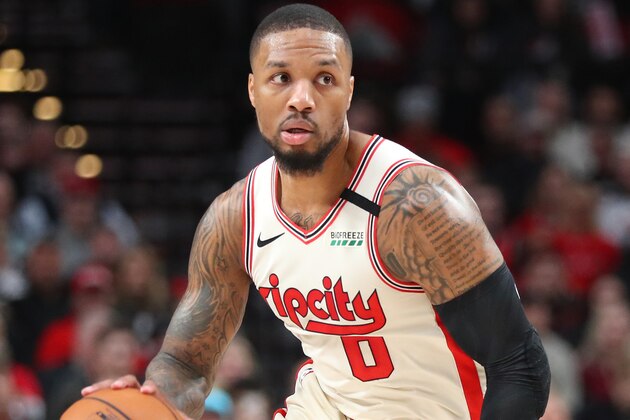 PORTLAND, OREGON - FEBRUARY 09: Damian Lillard #0 of the Portland Trail Blazers dribbles with the ball in the first quarter against the Miami Heat during their game at Moda Center on February 09, 2020 in Portland, Oregon. NOTE TO USER: User expressly acknowledges and agrees that, by downloading and or using this photograph, User is consenting to the terms and conditions of the Getty Images License Agreement. (Photo by Abbie Parr/Getty Images)