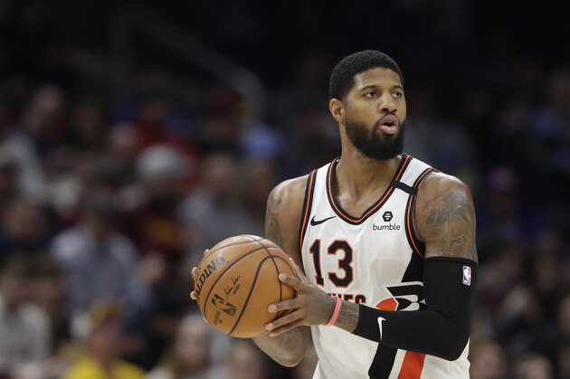 Los Angeles Clippers' Paul George drives against the Cleveland Cavaliers in the second half of an NBA basketball game, Sunday, Feb. 9, 2020, in Cleveland. (AP Photo/Tony Dejak)