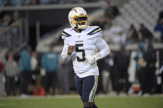 Los Angeles Chargers quarterback Tyrod Taylor (5) jogs to the sideline after a play during the second half of an NFL football game against the Jacksonville Jaguars Sunday, Dec. 8, 2019, in Jacksonville, Fla. (AP Photo/Phelan M. Ebenhack)