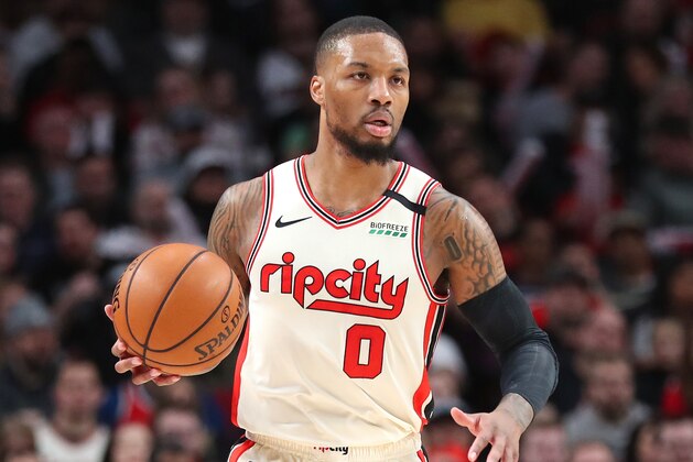 PORTLAND, OREGON - FEBRUARY 09: Damian Lillard #0 of the Portland Trail Blazers dribbles with the ball in the first quarter against the Miami Heat during their game at Moda Center on February 09, 2020 in Portland, Oregon. NOTE TO USER: User expressly acknowledges and agrees that, by downloading and or using this photograph, User is consenting to the terms and conditions of the Getty Images License Agreement. (Photo by Abbie Parr/Getty Images)