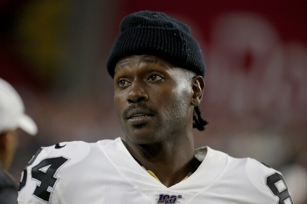 Oakland Raiders wide receiver Antonio Brown watches from the sidelines during the second half of an an NFL preseason football game against the Arizona Cardinals, Thursday, Aug. 15, 2019, in Glendale, Ariz. (AP Photo/Rick Scuteri)