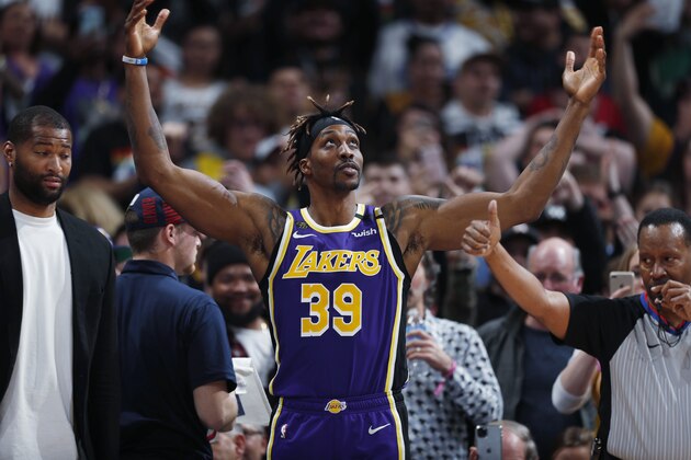 Los Angeles Lakers center Dwight Howard gesturres after the Lakers took the lead in overtime of an NBA basketball game against the Denver Nuggets on Wednesday, Feb. 12, 2020, in Denver. The Lakers won 120-116. (AP Photo/David Zalubowski)
