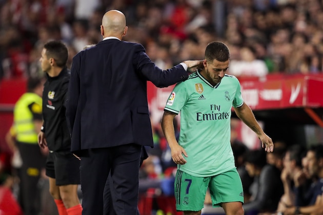 SEVILLA, SPAIN - SEPTEMBER 22: (L-R) coach Zinedine Zidane of Real Madrid, Eden Hazard of Real Madrid during the La Liga Santander  match between Sevilla v Real Madrid at the Estadio Ramon Sanchez Pizjuan on September 22, 2019 in Sevilla Spain (Photo by David S. Bustamante/Soccrates/Getty Images)